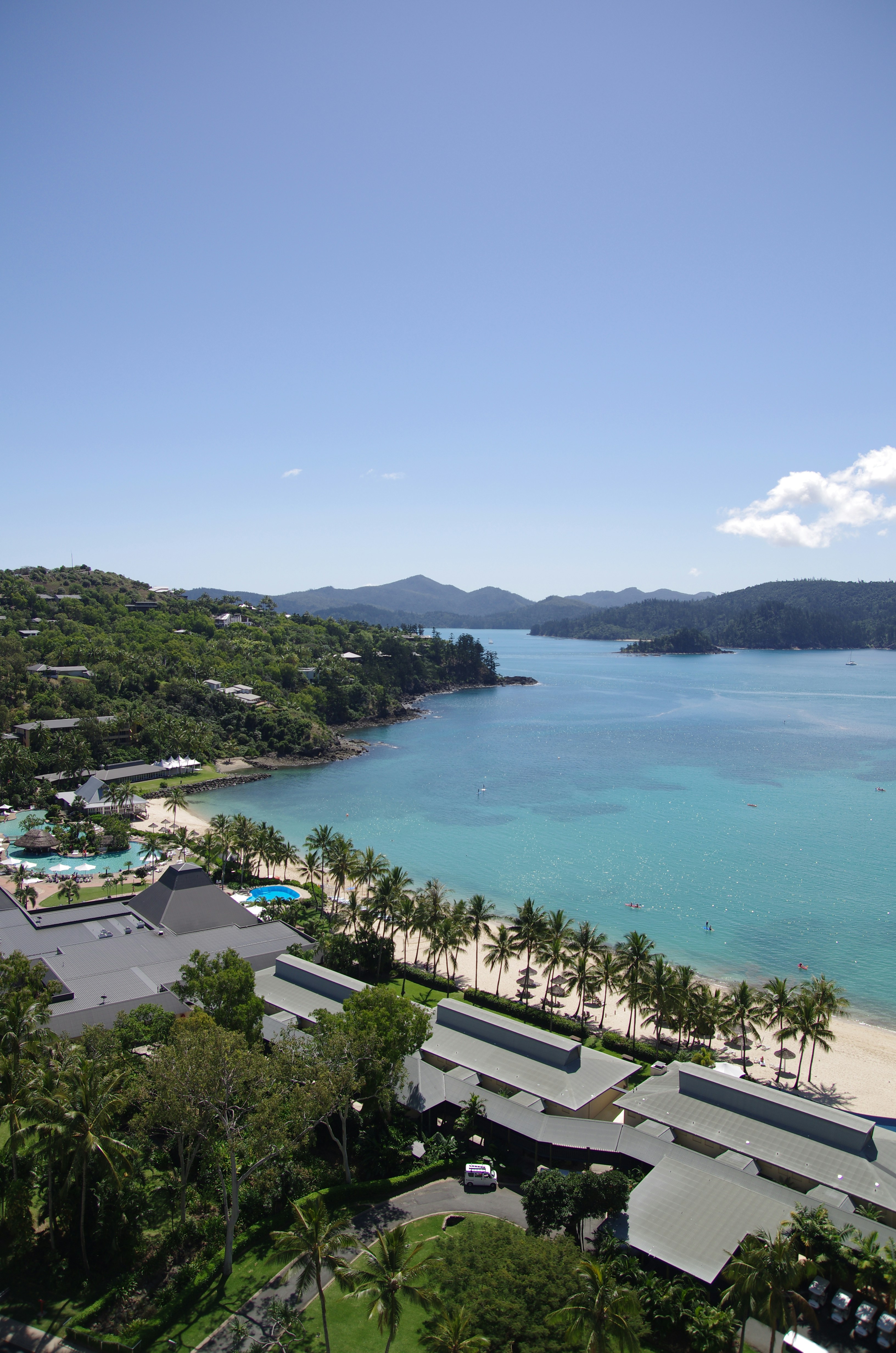 A beach with trees and buildings photo – Free Beach Image on Unsplash