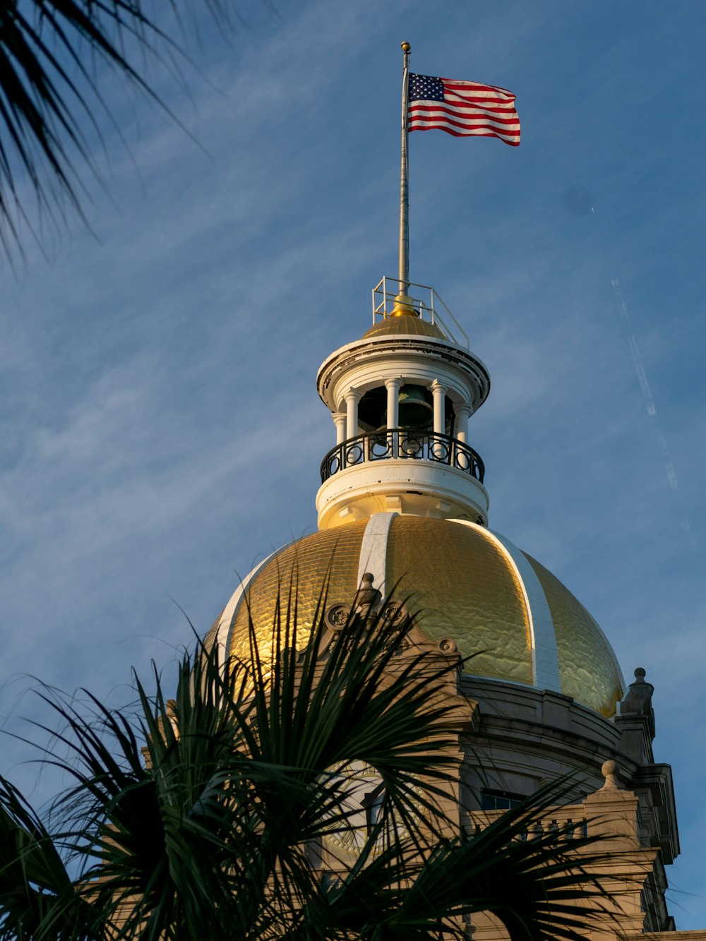 a flag on top of a domed building