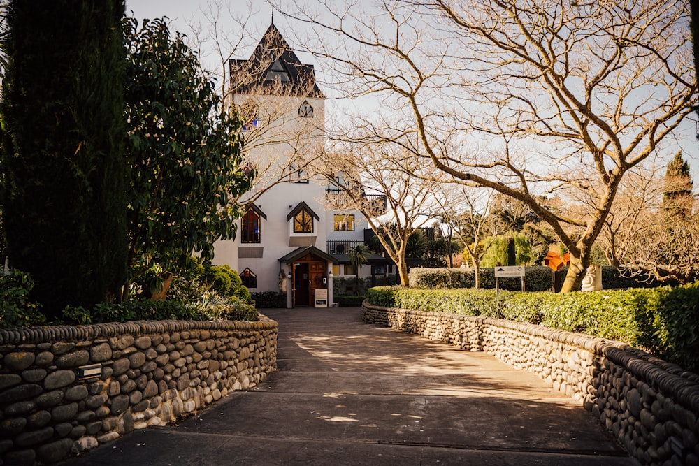 a stone path leading to a church