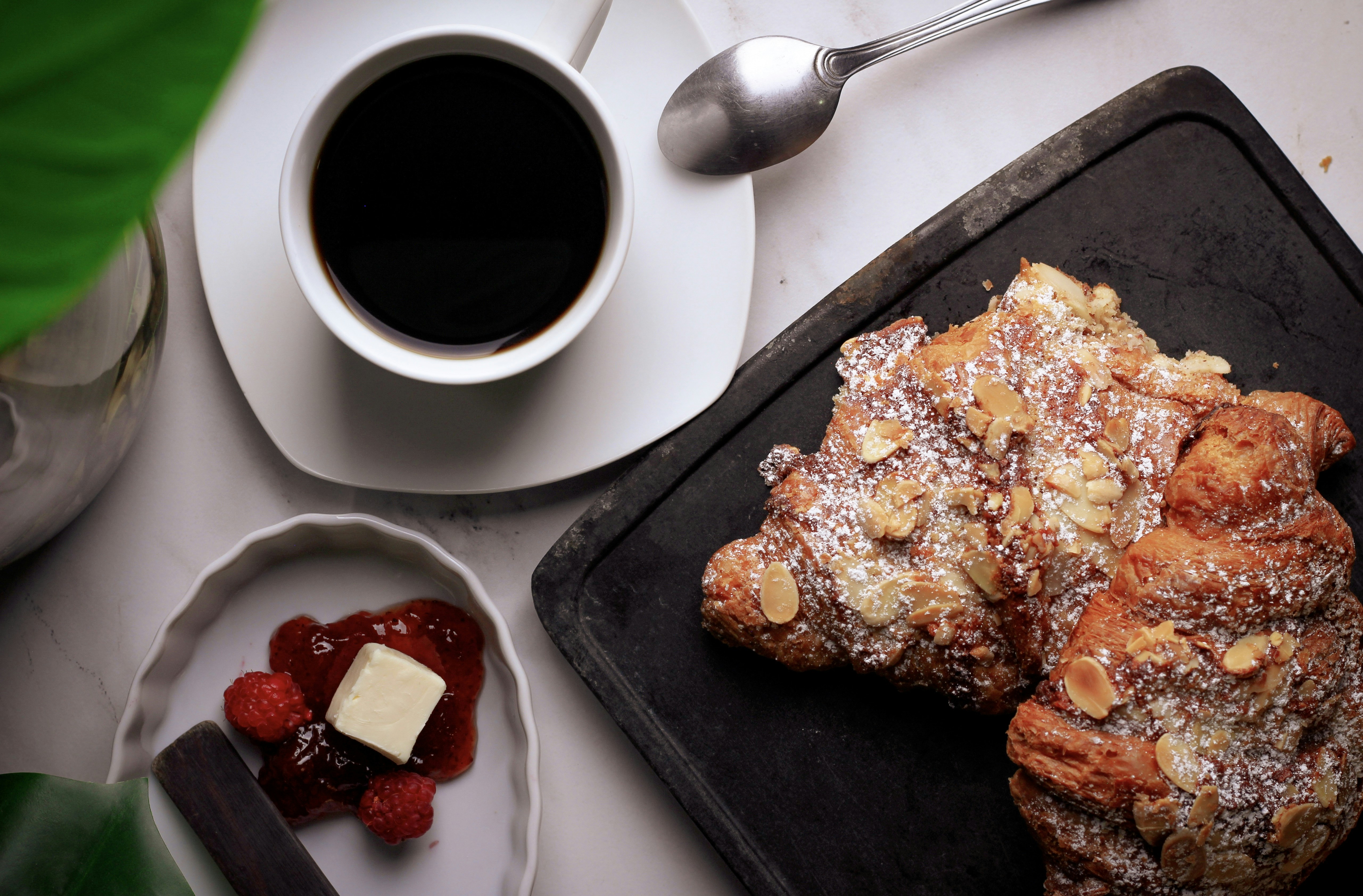 a plate of food and a cup of coffee