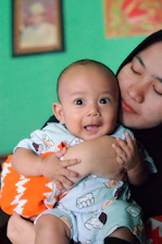 a person holding a baby