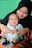 a person holding a baby