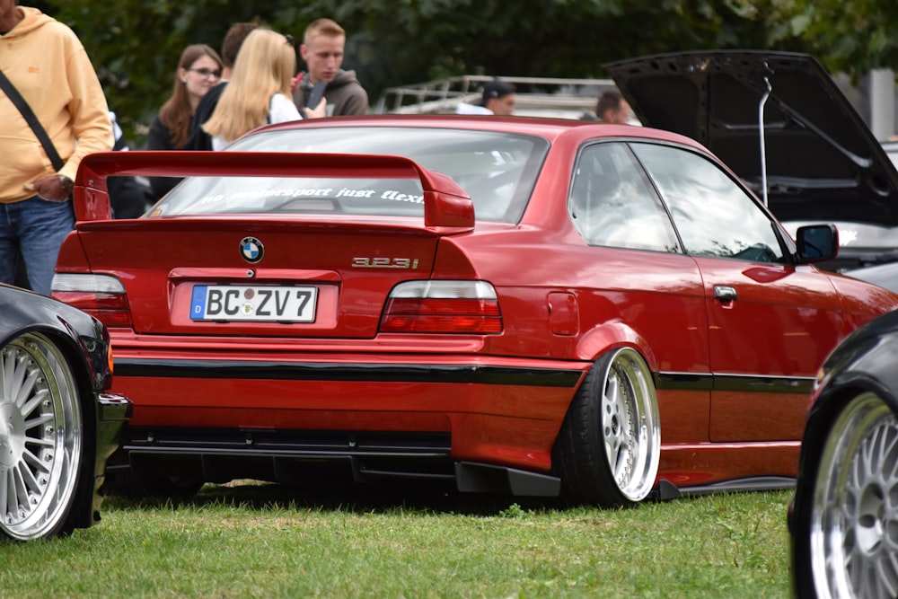 a red car with its doors open