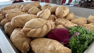 A vibrant close-up of a freshly baked empanada with a golden crust and colorful filling.