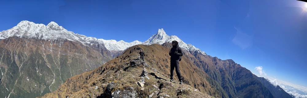 a person standing on a rocky mountain