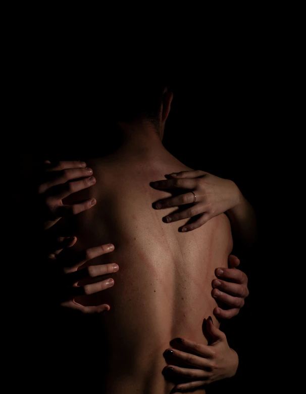 Murdered by Darkness Image a person holding the hands together