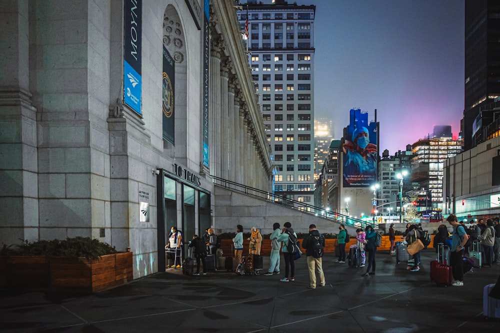 a group of people standing outside a building