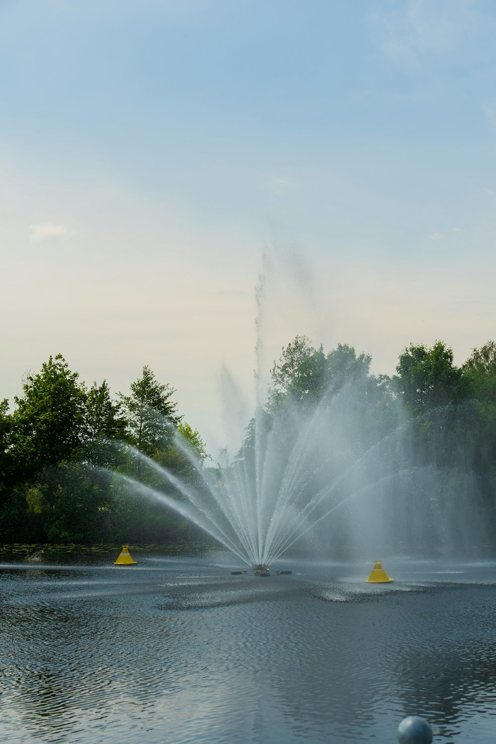 a fountain in a pond