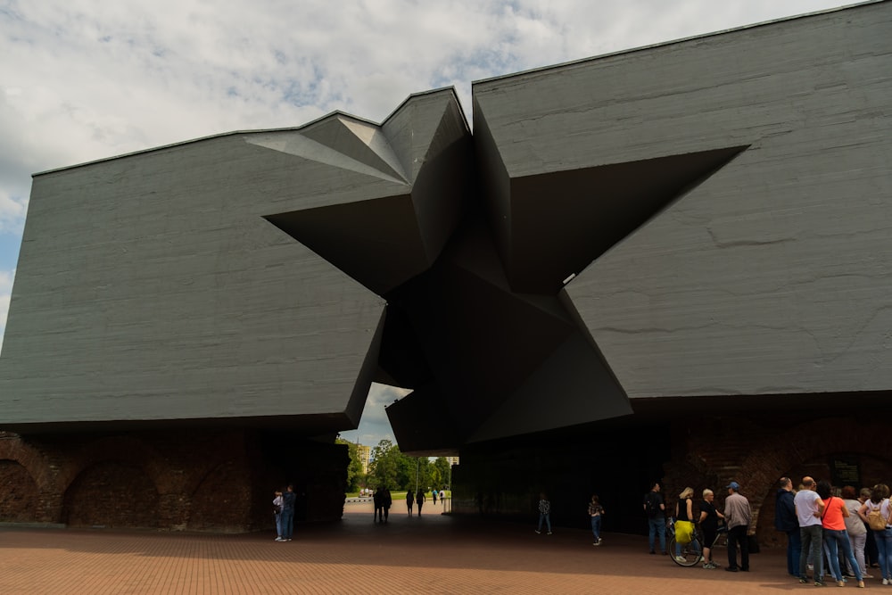 a group of people standing outside Denver Art Museum