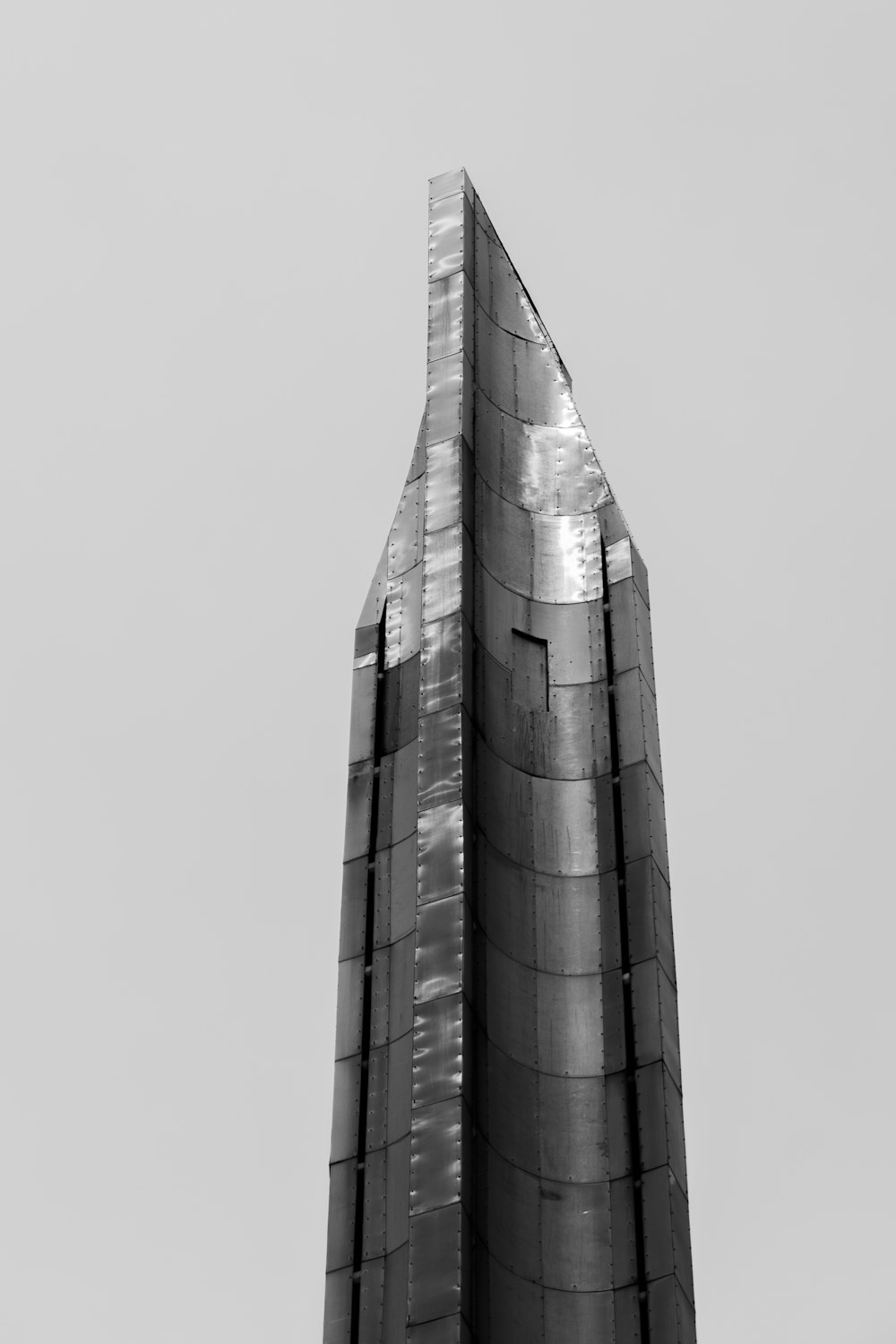 a tall building with a curved top