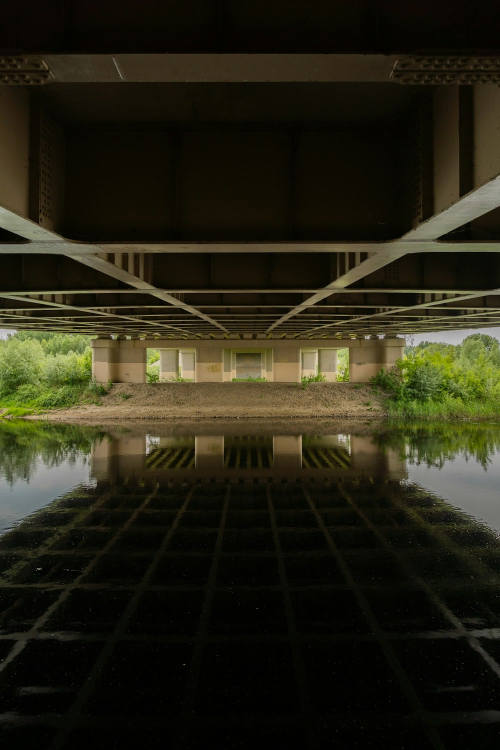 a building with a pond in front of it