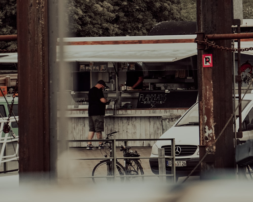 a person standing next to a bicycle