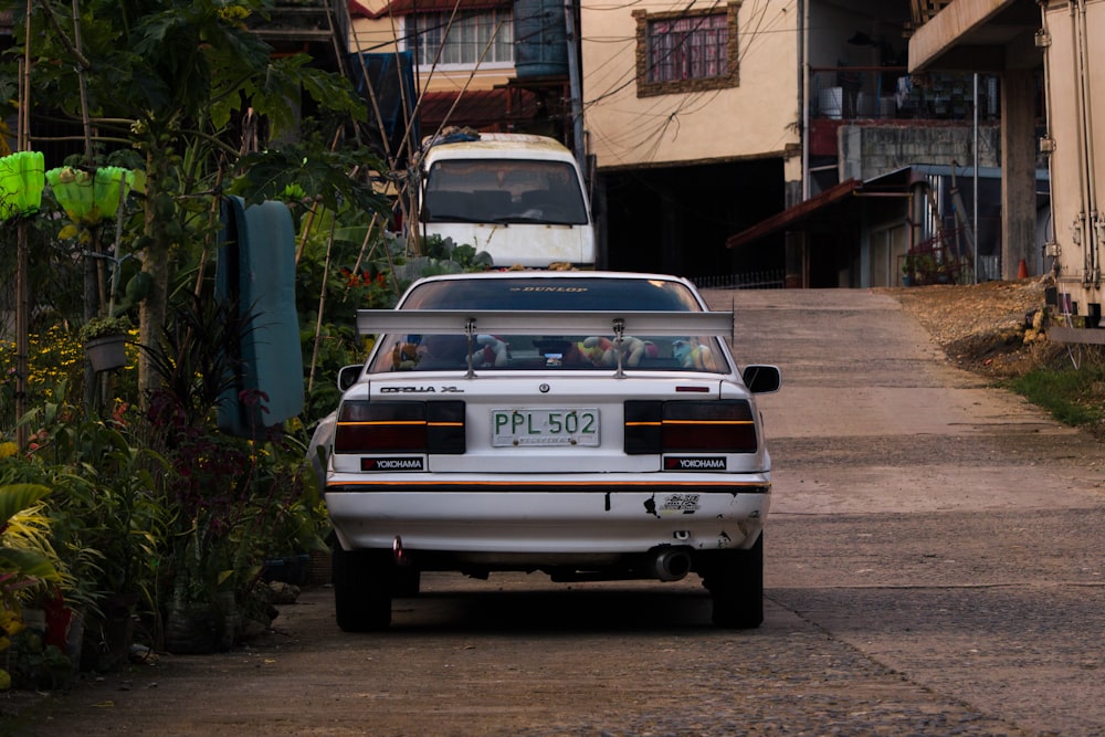 a white car parked on a street