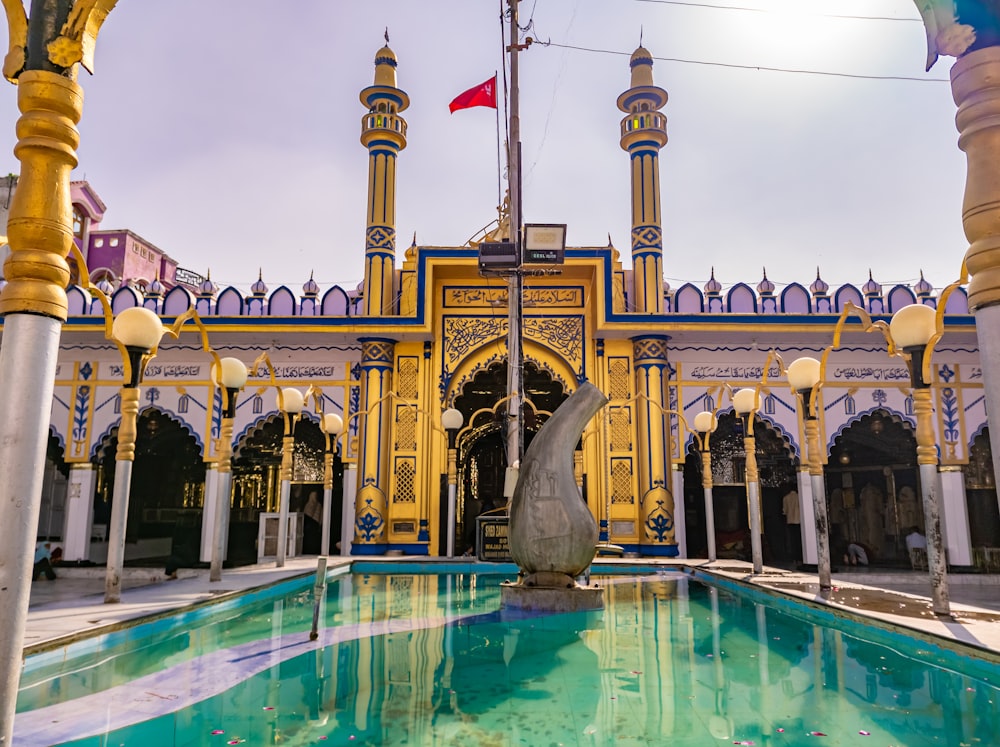 a large building with a statue in the middle of it