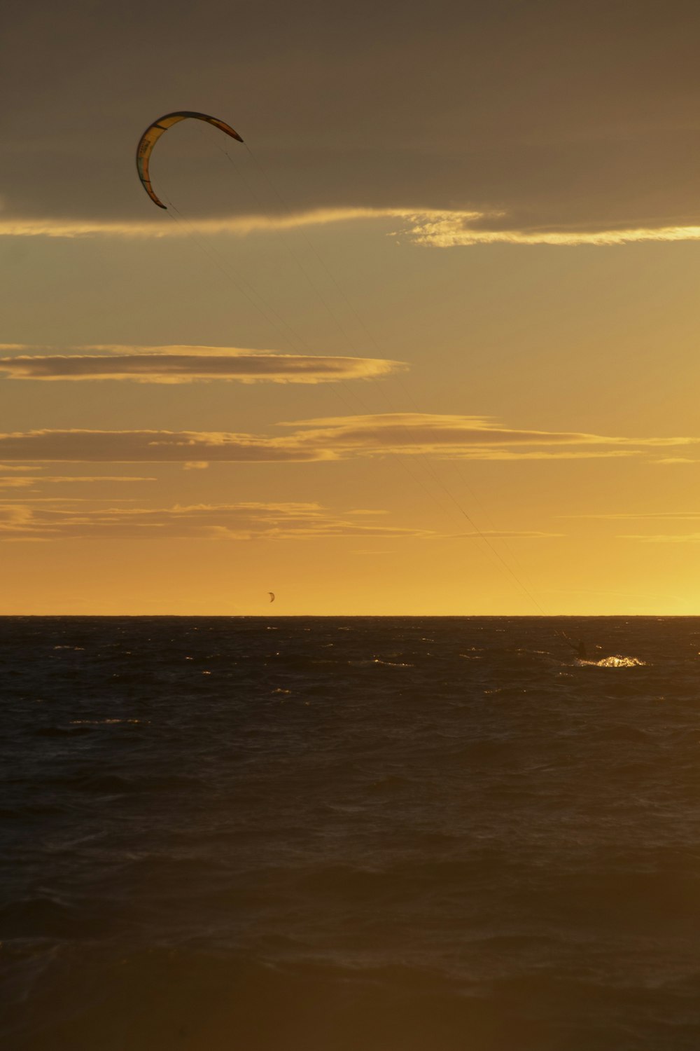 a person parasailing over the ocean