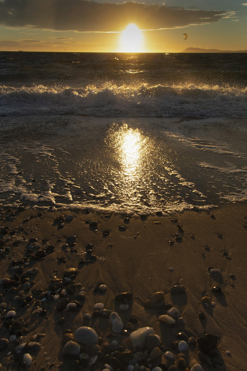 a beach with a sunset