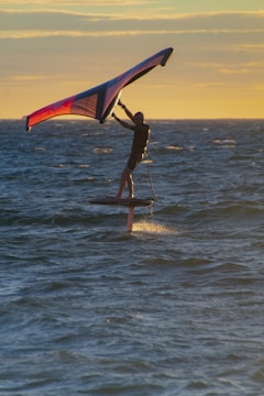 a man kite surfing in the sea