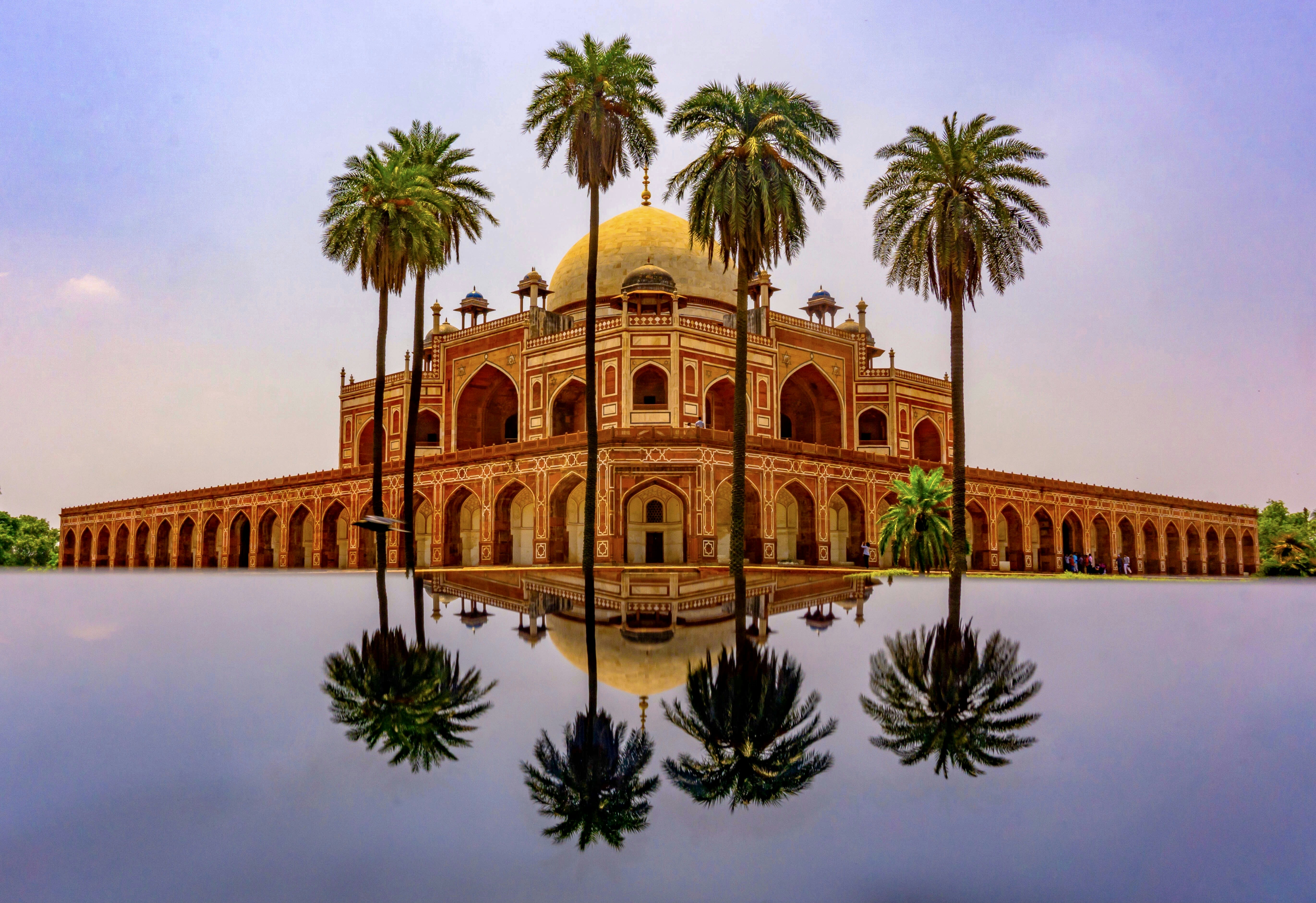a building with palm trees in front of it