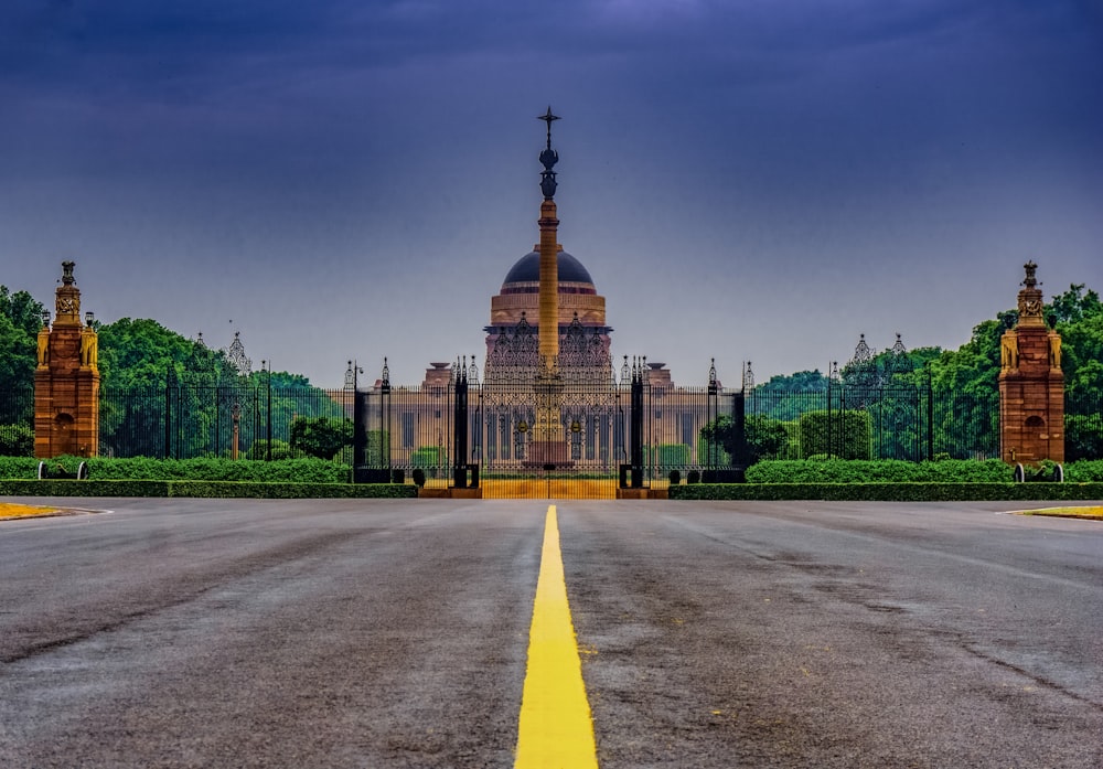 a road with a building in the background