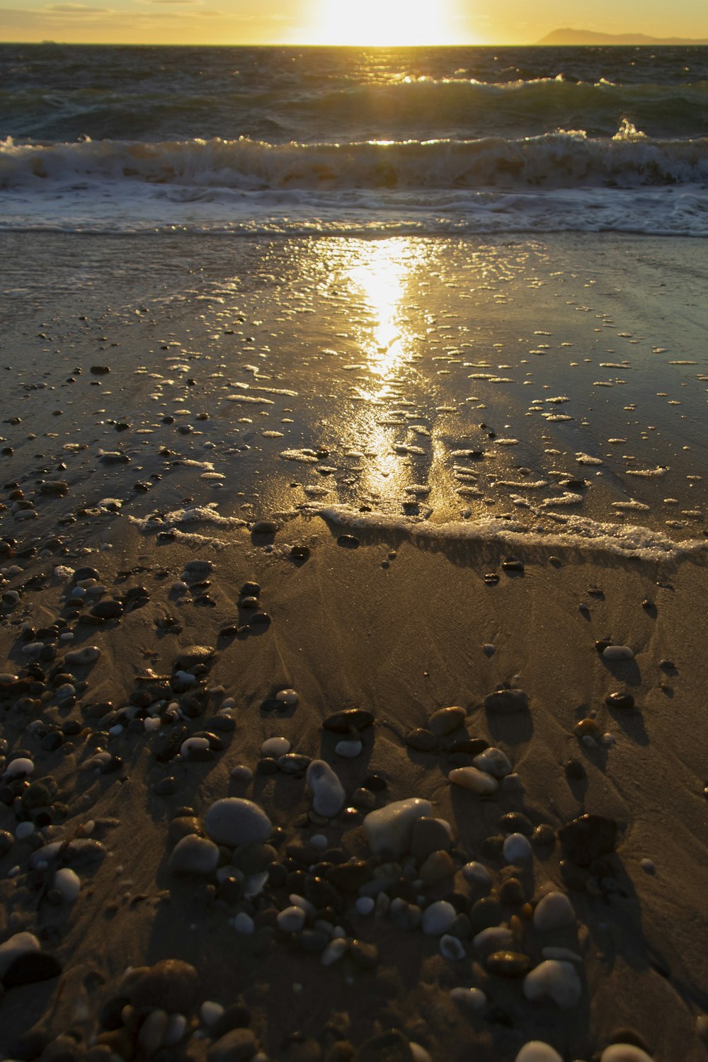 a beach with rocks and water