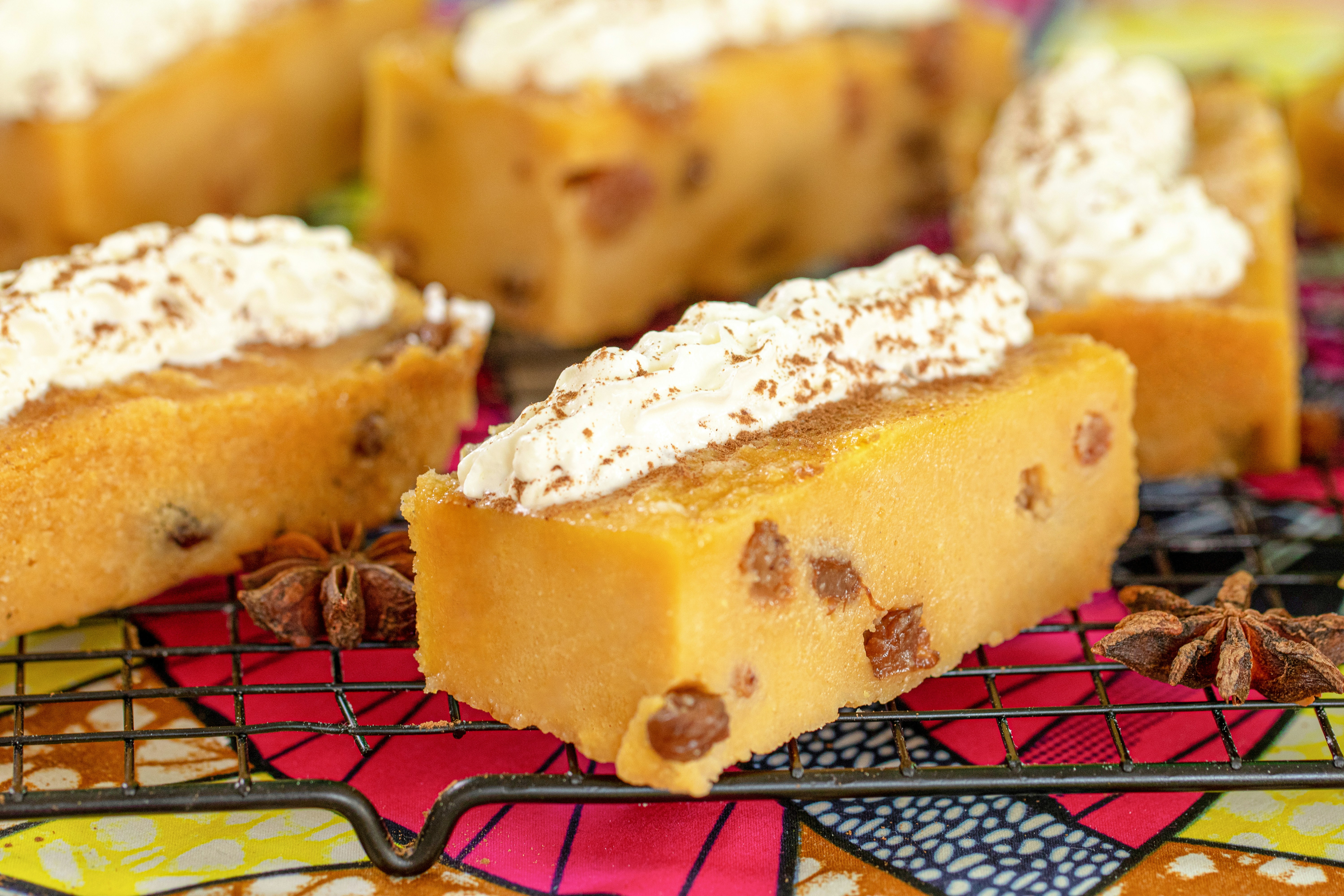 a group of breads on a rack, Dominican Style Arepa (Cornmeal and Coconut Cake)