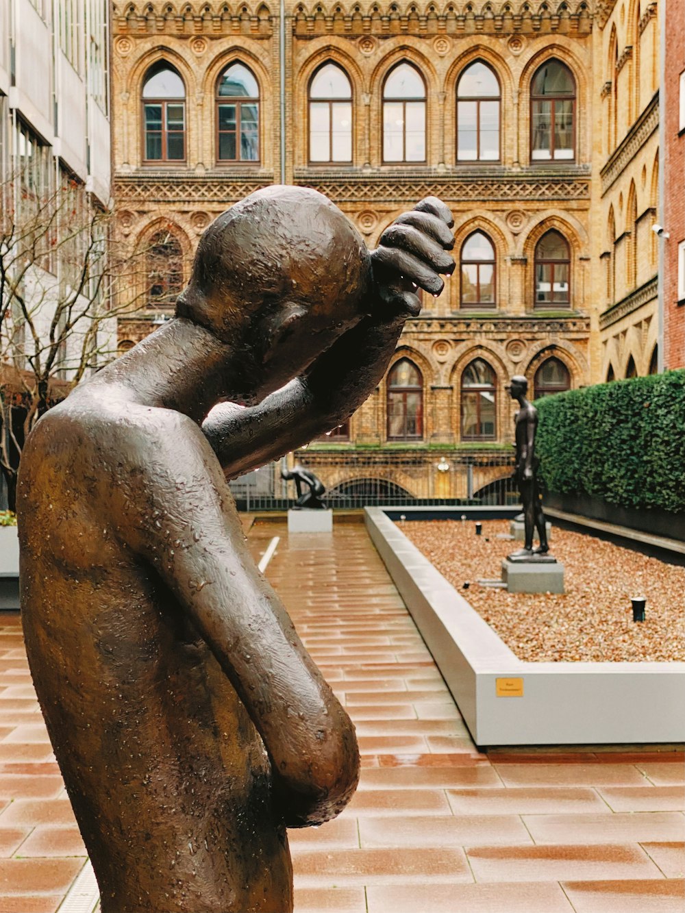 a statue of a person holding a gun