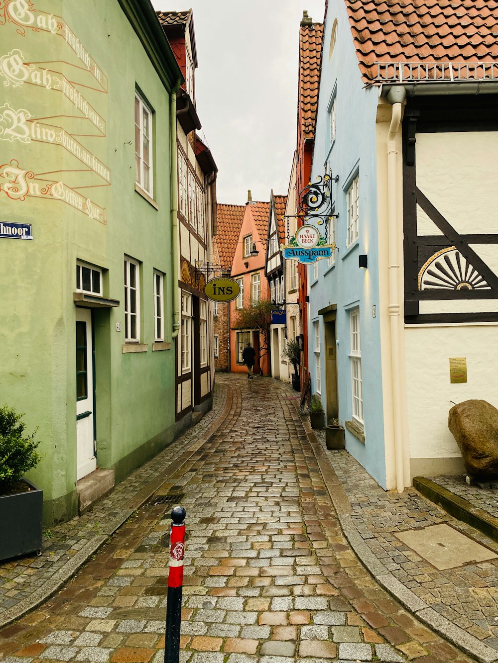 a narrow street with buildings on both sides