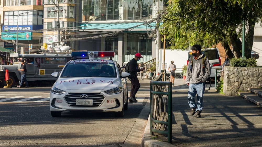 a police car parked on the side of a street