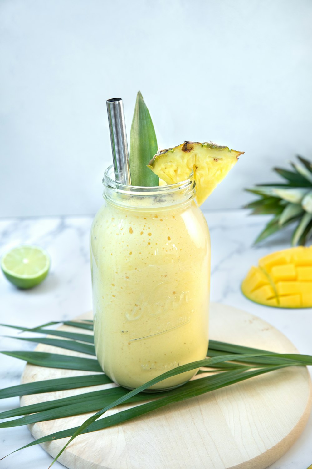 a glass jar with a lemon slice in it