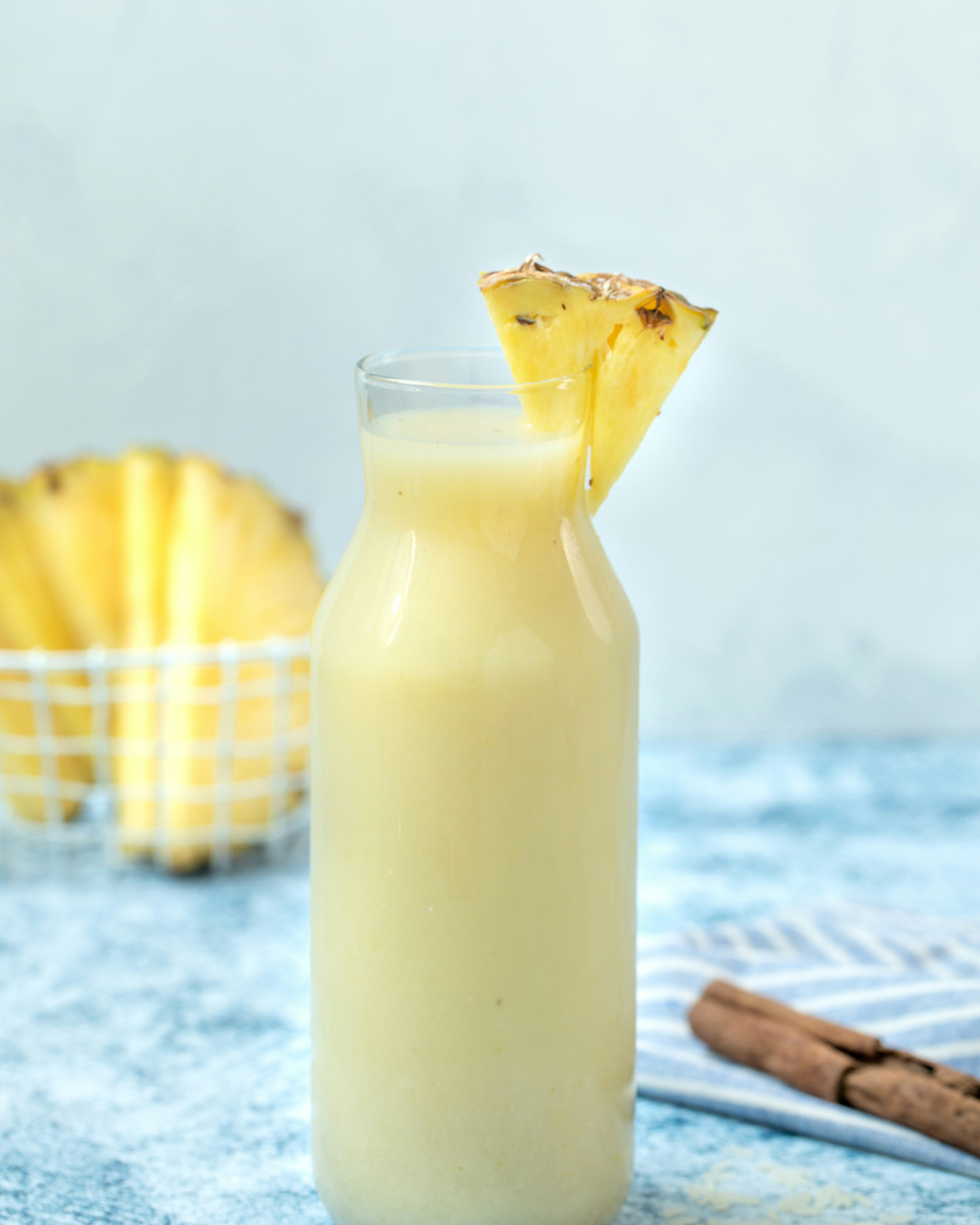 a glass of lemonade with a slice of lemon on top