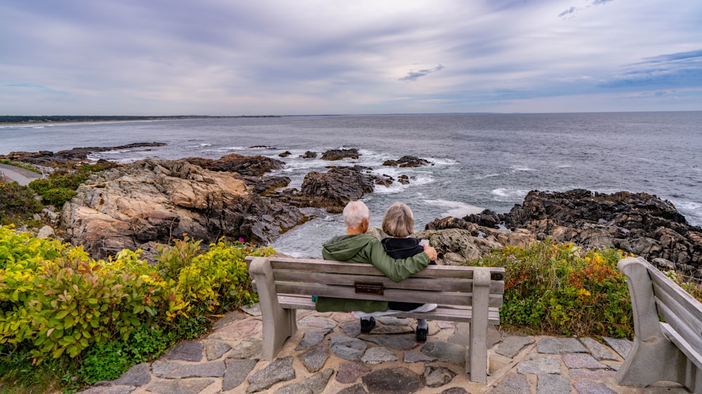 a couple sitting on a bench