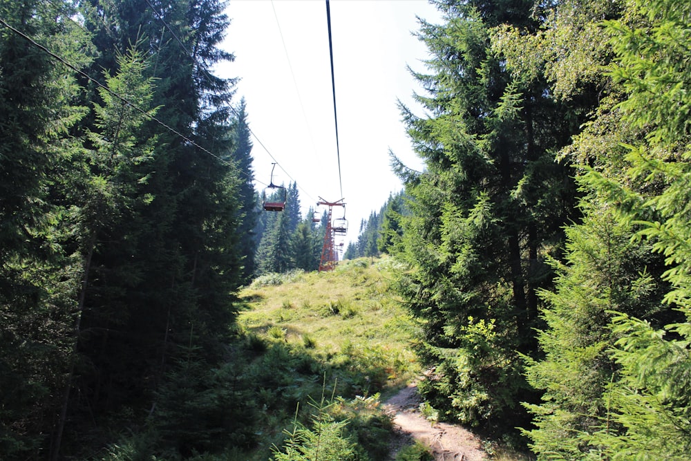 a cable car going over a hill