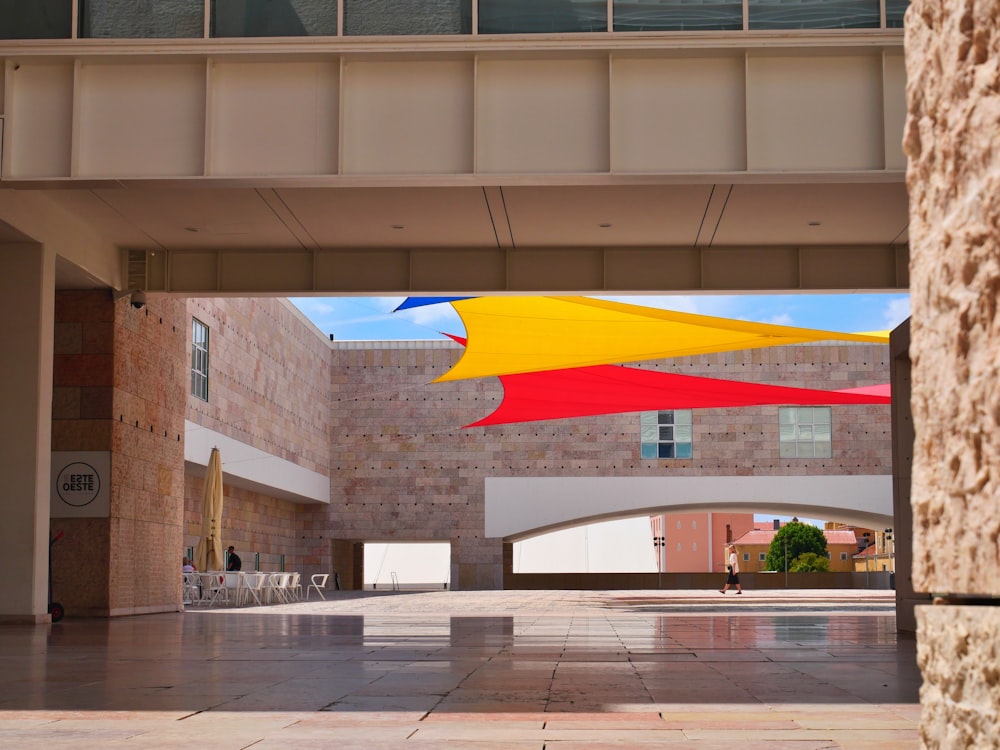 a building with a few colorful flags