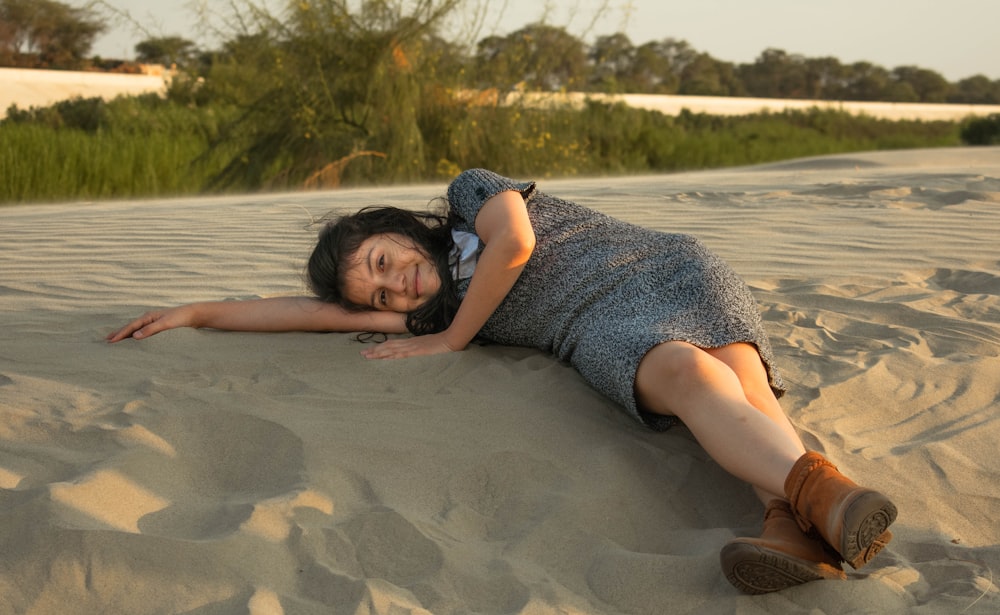 a person lying on the sand