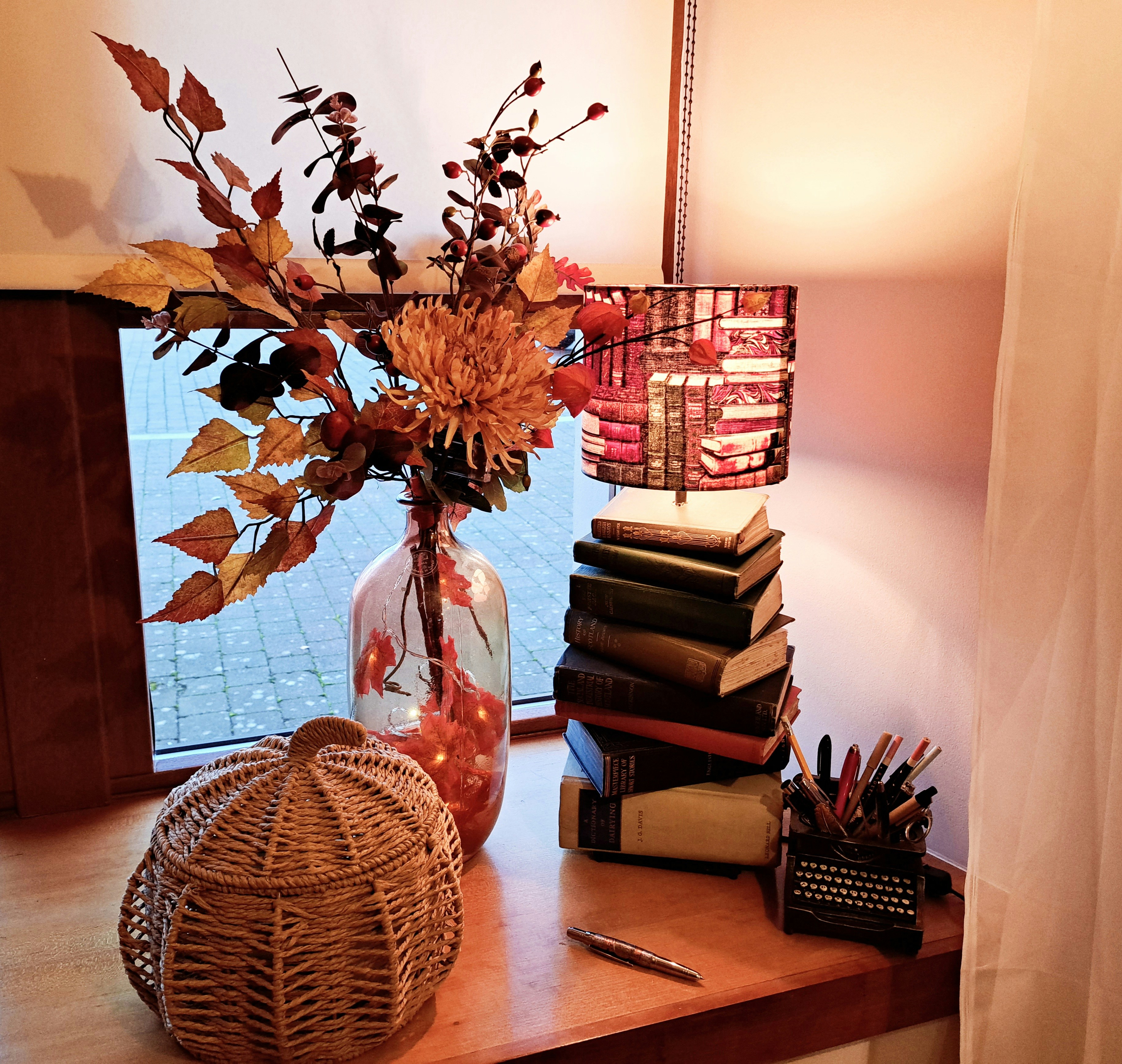 a vase with flowers on a table