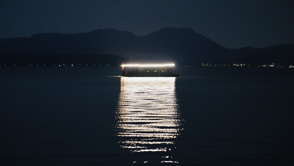 a body of water with a city in the distance