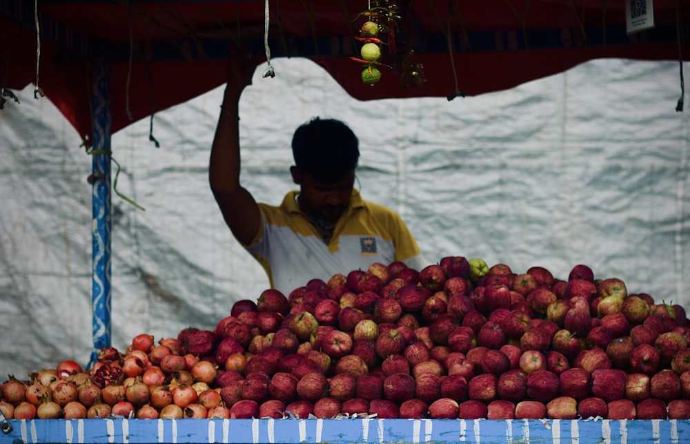 a person selling fruits