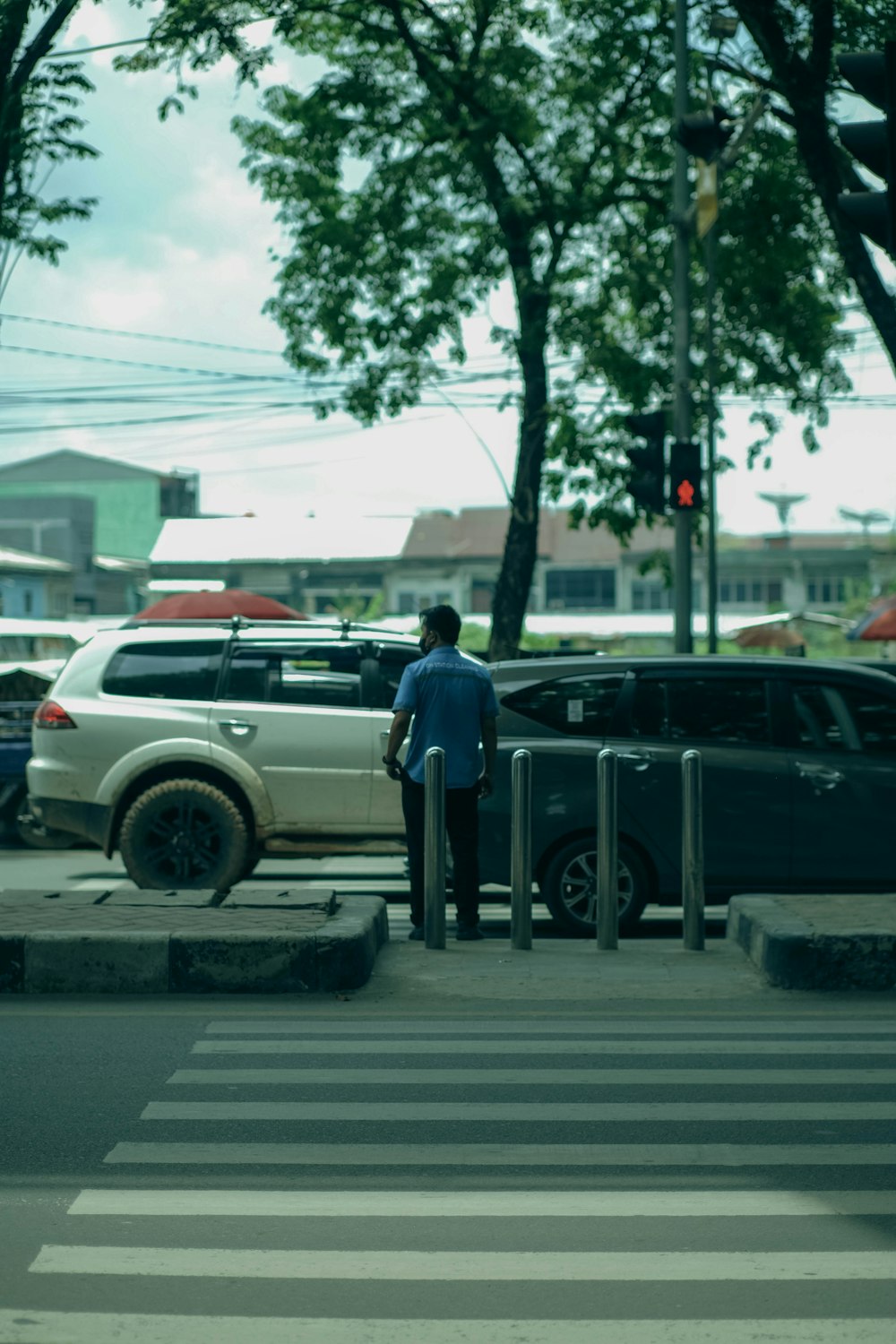 a person standing in the middle of a crosswalk