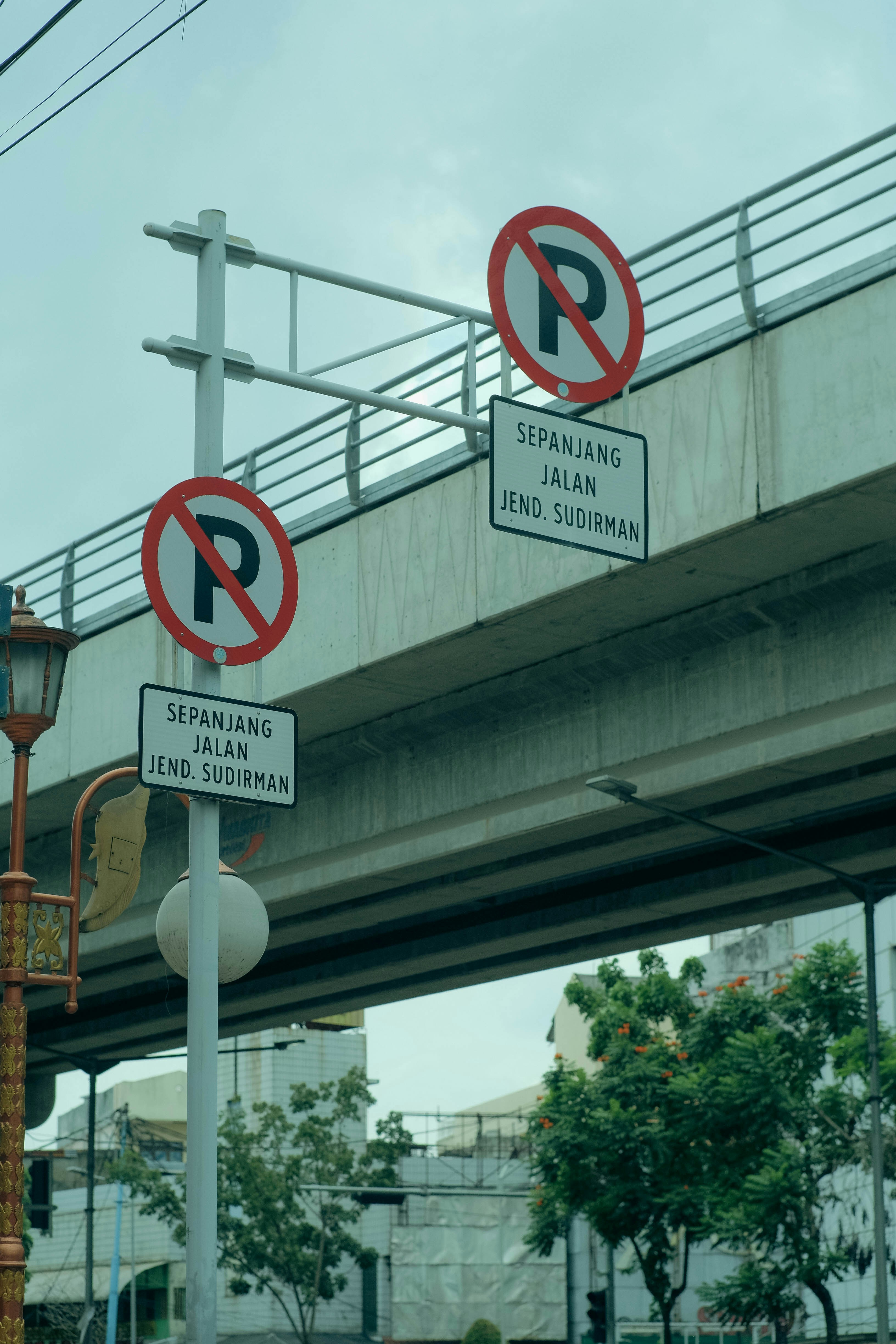 a group of signs on a pole