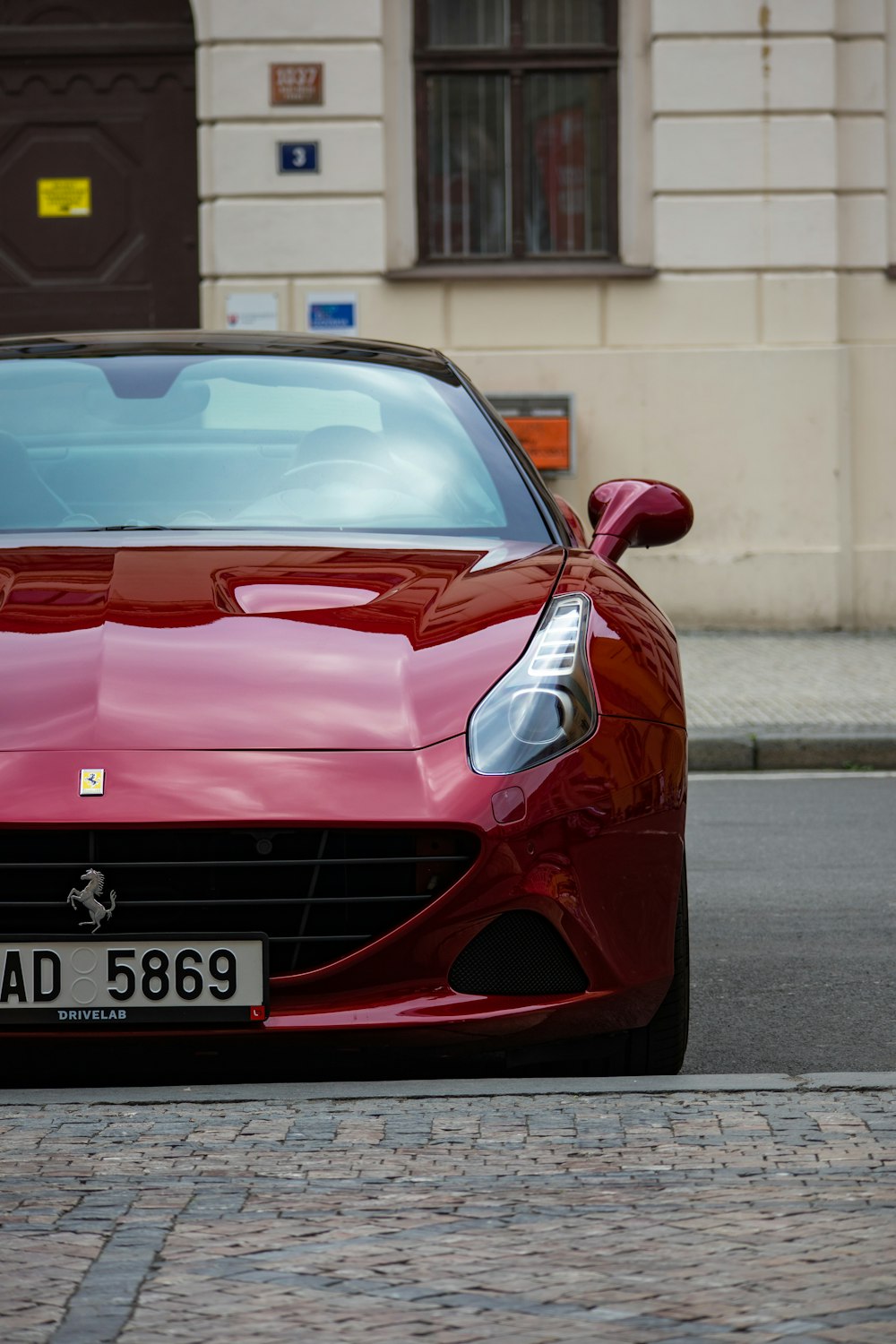 a red car parked on a street