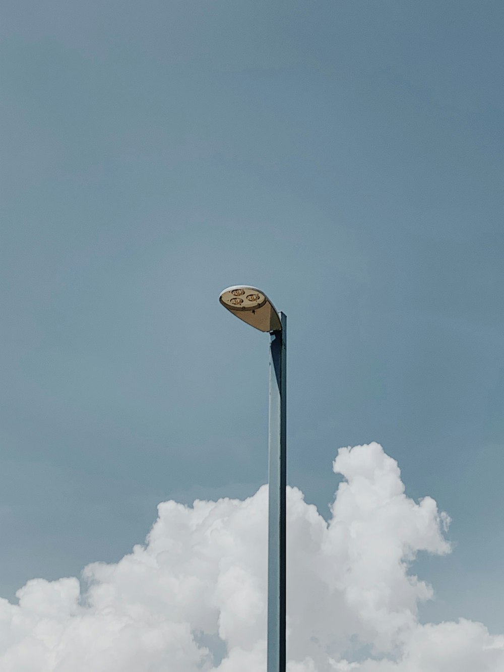 a light post with a sign on top of it