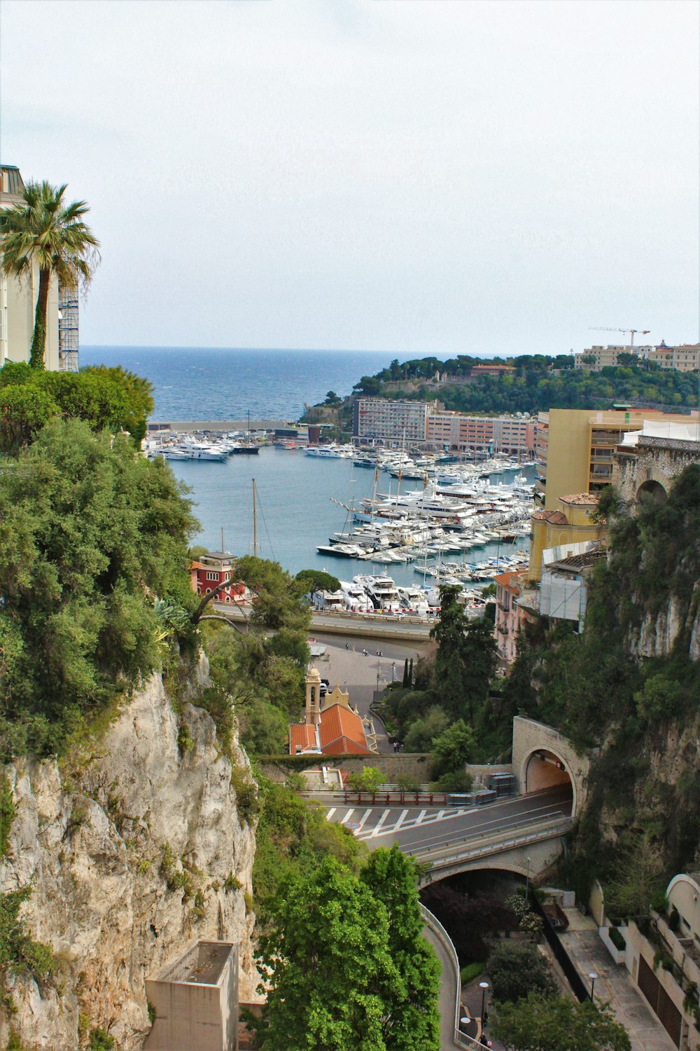 a bridge over a body of water with boats on it