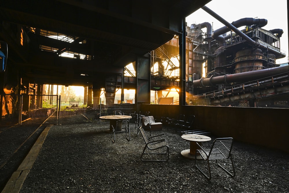 a group of tables and chairs outside