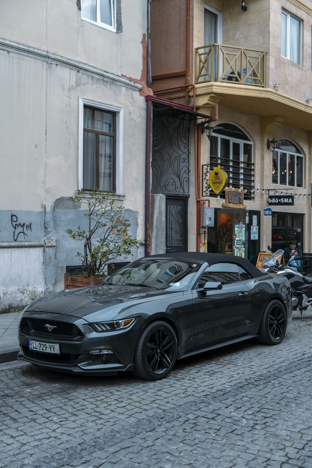 a black car parked on a street