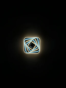 Golden sacred geometry pattern glowing softly on a beige background