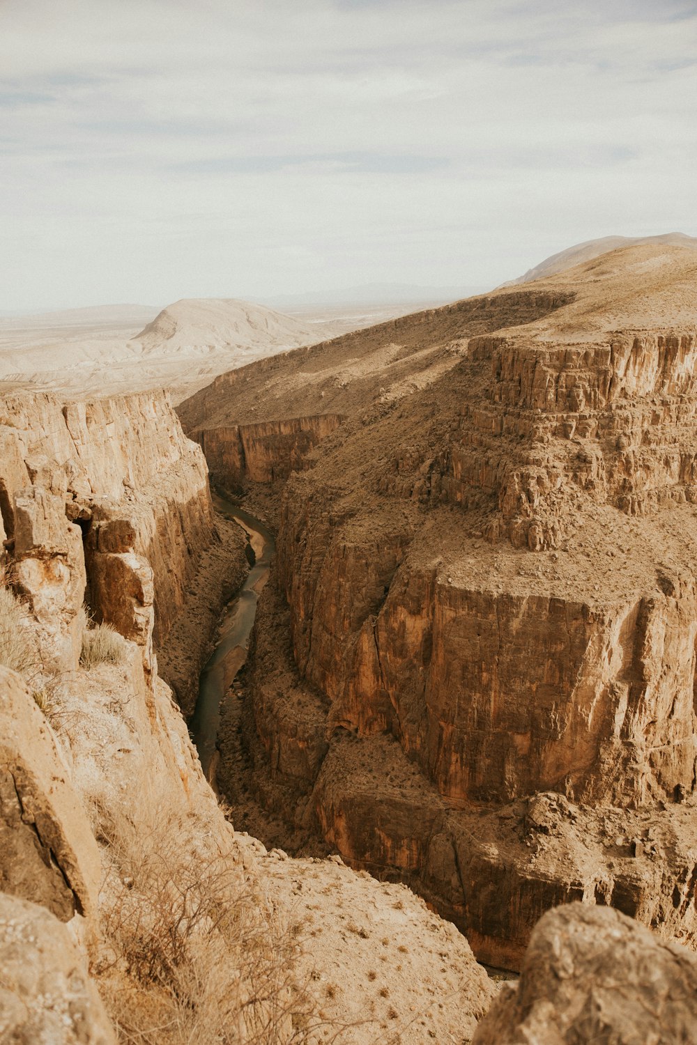 a rocky canyon with a river running through it