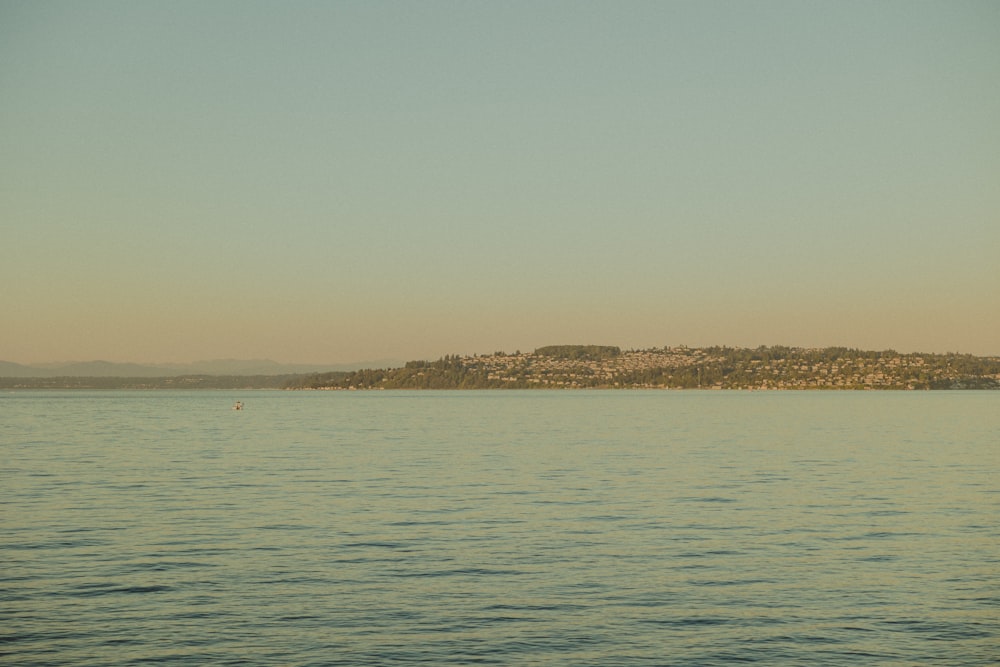 a body of water with land in the distance