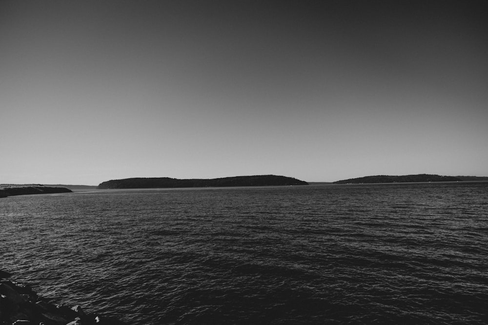 a body of water with land in the distance