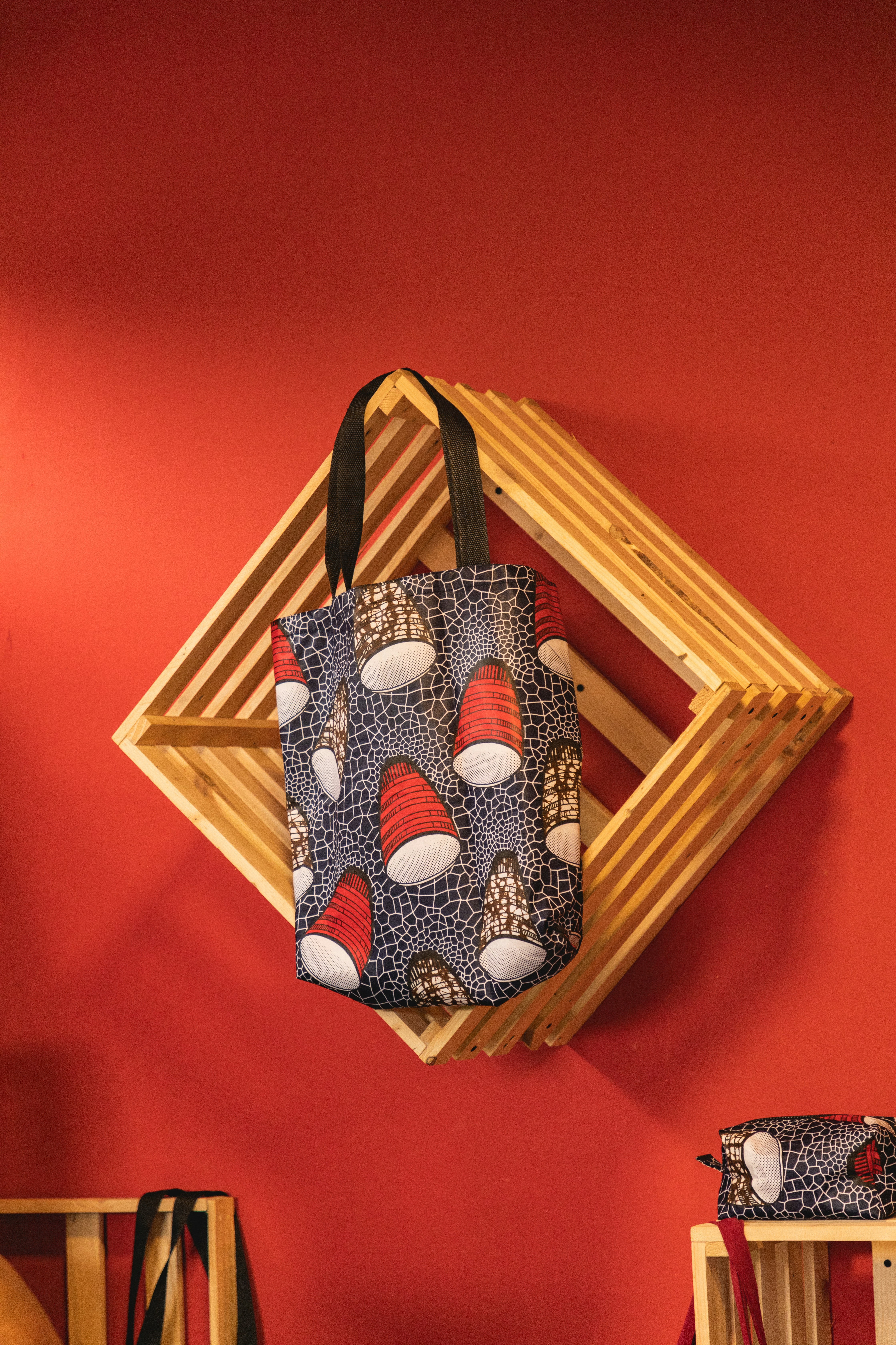 a wooden birdhouse with a bird design on it