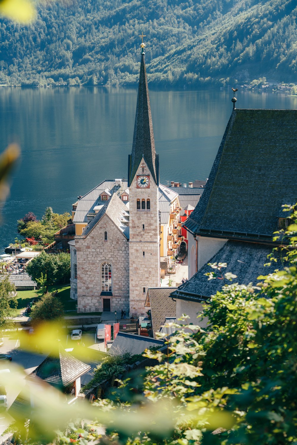 a building with a tower by a body of water